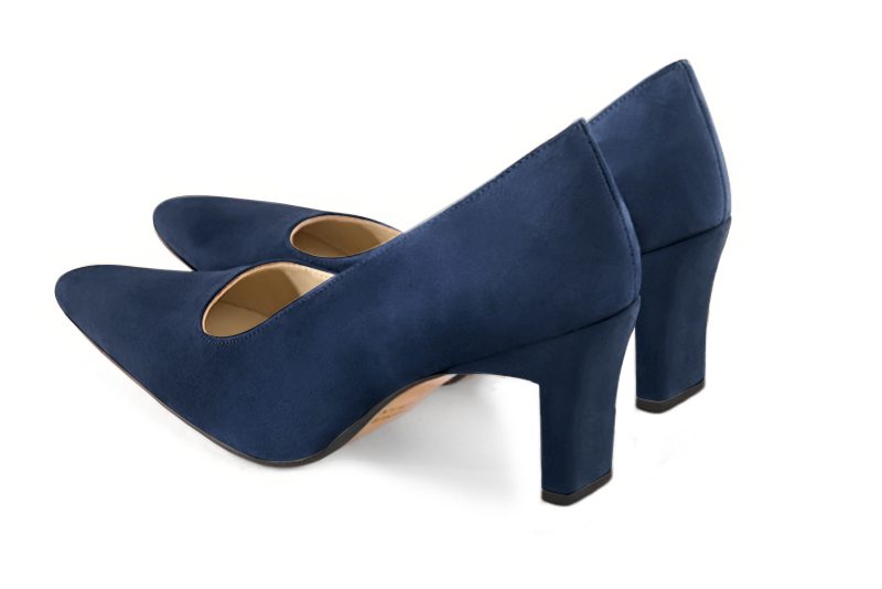 Navy blue dress pumps with a square neckline. Tapered toe. High comma heels